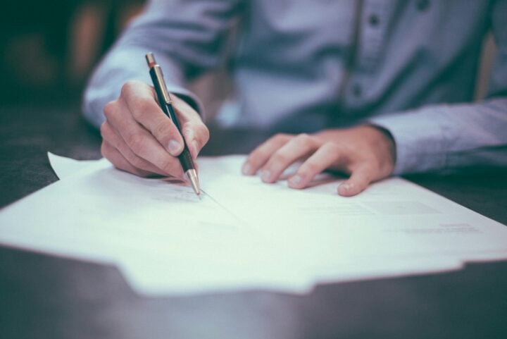 man proofreading documents