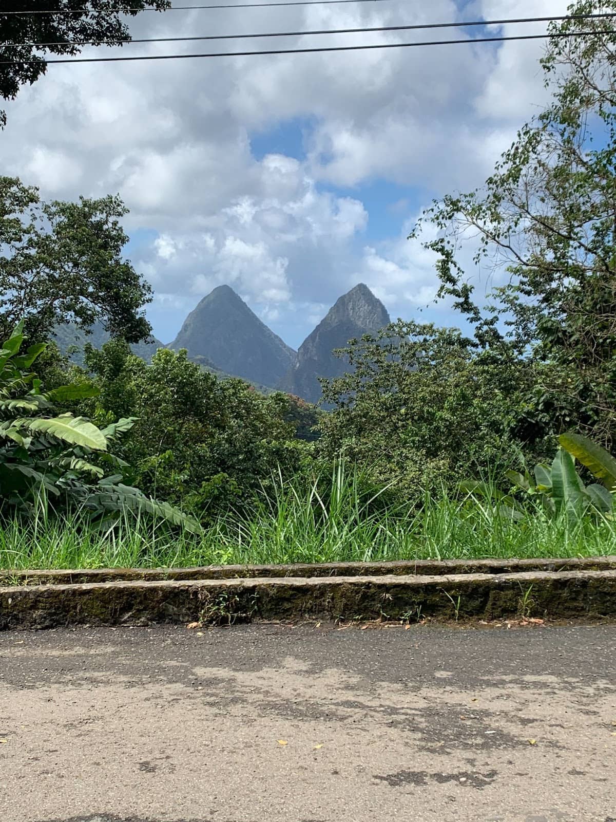 View of the Pitons from the road in St. Lucia, where hiking these iconic peaks was a trip highlight.